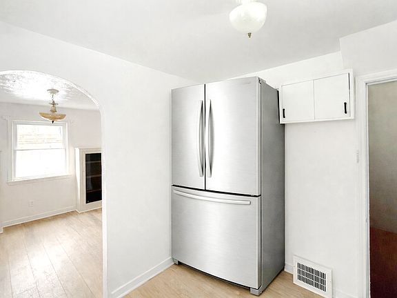First floor _ freshly updated kitchen with a brand new French door refrigerator and 4-burner stove