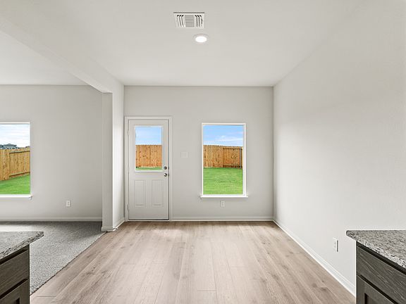 The dining room sits off of the kitchen and has great, natural light.