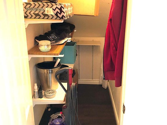 coat closet for guest under the stairs