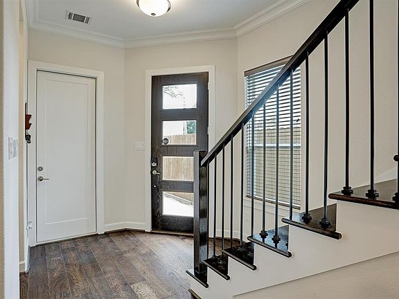 The garage entry is just to the left of the front door.