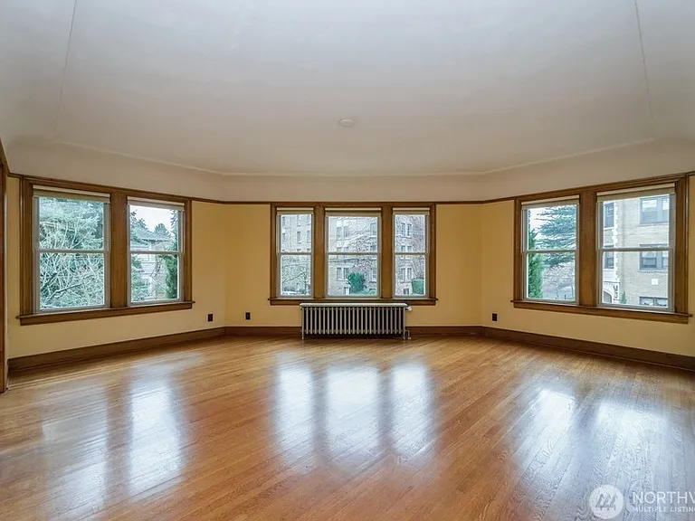 Windows encase this oversized living room.