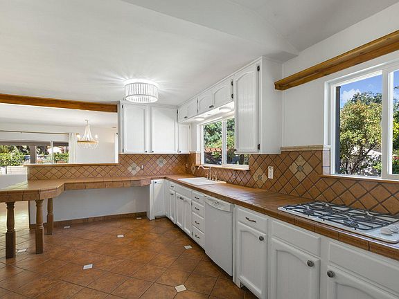 Kitchen with windows overlooking the side yard