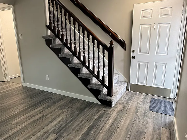 Living room view to stairs and storage closet
LED lighting