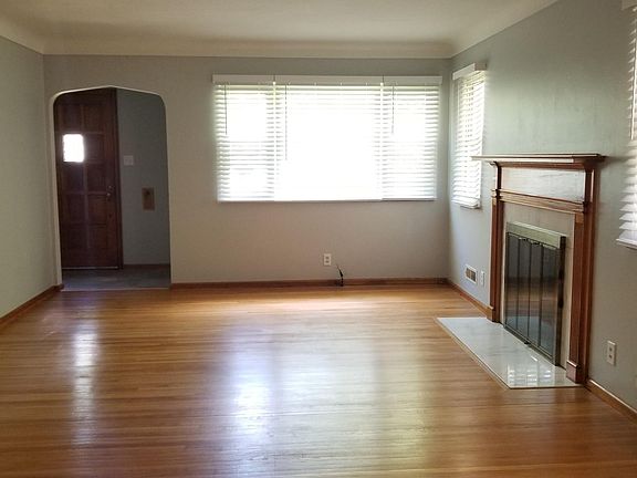 huge bright living room with all new blinds and beautiful hardwood floors!