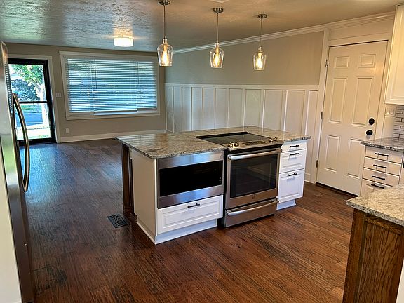 Island kitchen with family room area in background