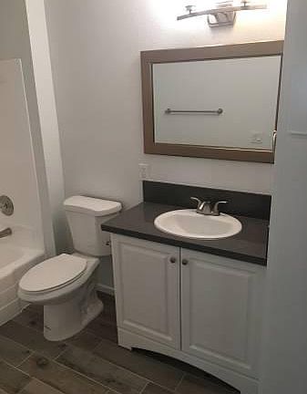 Fully remodeled bathroom. Quartz countertop matches the kitc