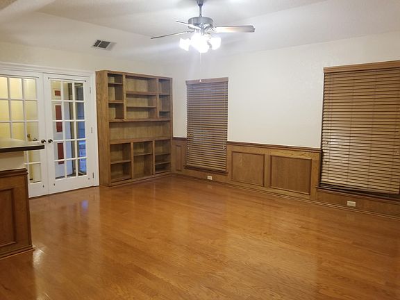 Builit in Bookshelves, French Doors to Entry Hall