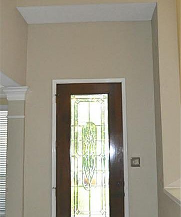 ENTRY w/ Soaring Ceiling and Elegant Leaded Glass Door.