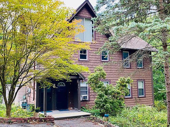 Apartment in on the second floor of a hundred year old farm house. House shares a driveway with three other houses. There is a small patio on the side of the house or you can fit chairs out front in the summer. The back of the house overlooks a field with