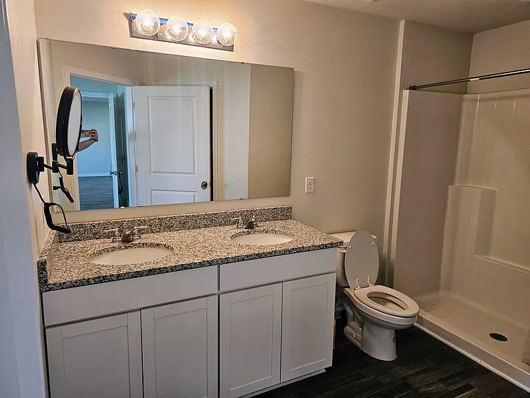 Jack and Jill Master bath with attached very large walk in closet (Next pic). In the mirror you see me in the master bedroom.