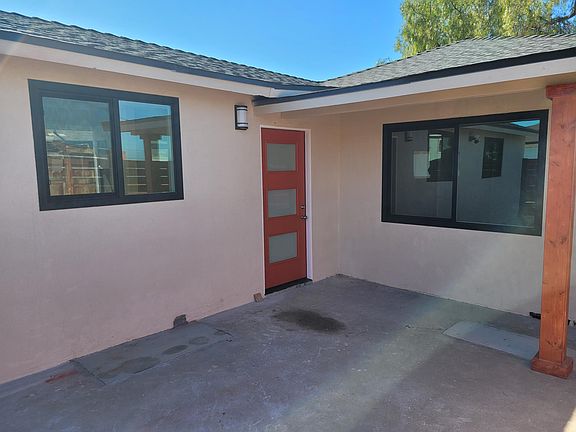 Front entrance through ENCLOSED patio.