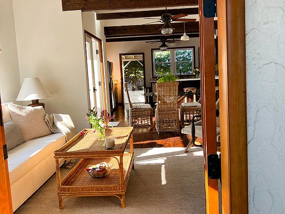 Spanish wood door opens to bright open interior