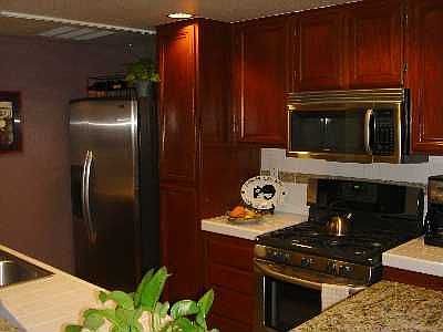 Unit's kitchen w/ all stainless appliances