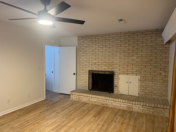 Den connected to the kitchen and laundry room.