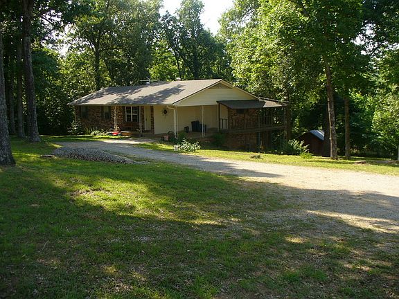 House sits back into large shaded yard
						:
						From the inside looking out, are views of trees and wildlife, not the road.
