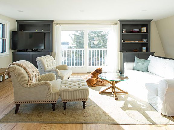 Living area with view of main harbor and lighthouse.