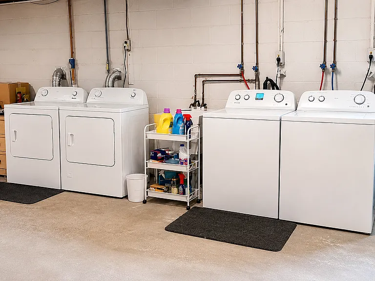 Clean and functional laundry room in full basement