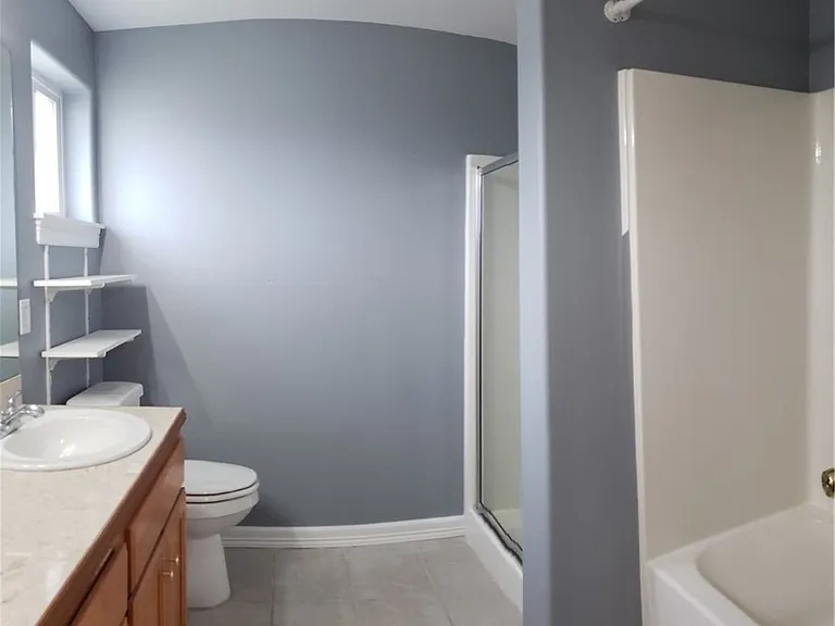 Master bath with standing shower and tub