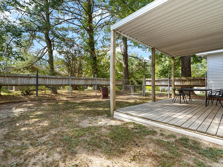 fenced back yard and deck