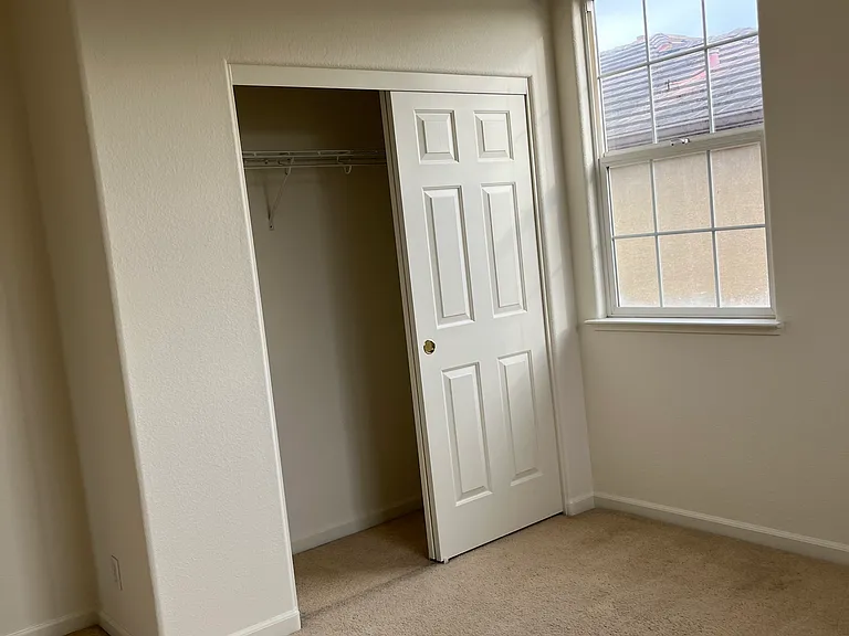 Bedroom 2 has regular closet, 2 windows