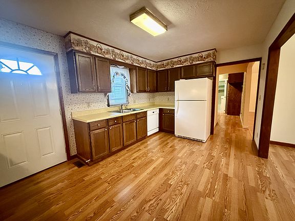 Kitchen with dishwasher and refrigerator.