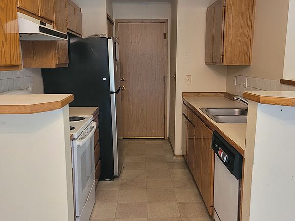 Another view of the kitchen leading to the 2 car garage.