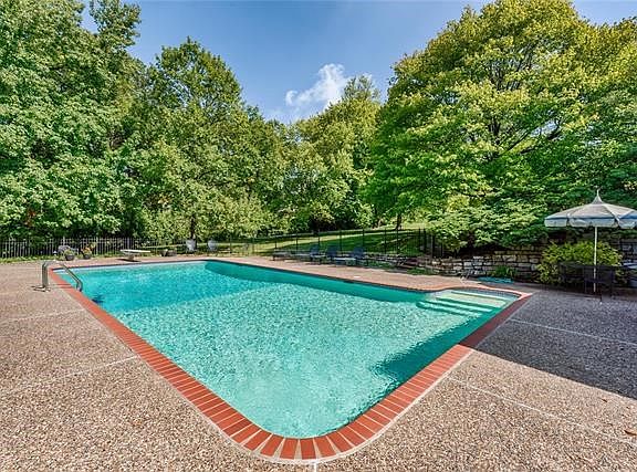 Fabulous inground pool amidst the private acre setting...