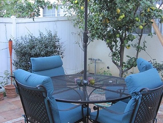 Charming private patio with custom tile, an insane