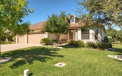 Another view of the front and side of house.  Plenty of room on lot.