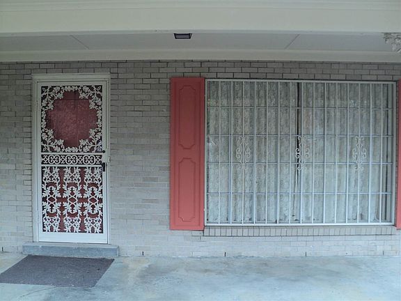 Covered front porch welcomes guest to the home.