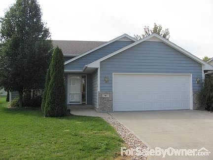 Front street view
						:
						Mature landscaping sets off a welcoming front entry.