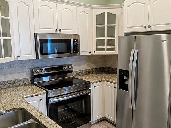 Electric stove, microwave, refrigerator, and dishwasher included