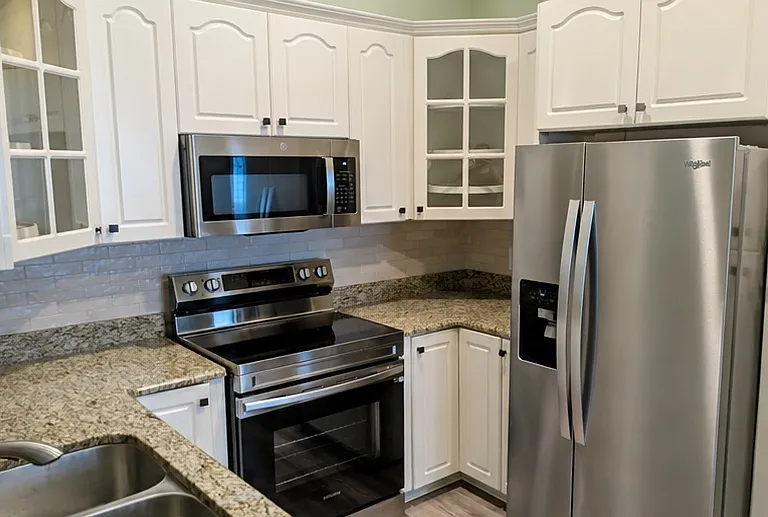 Electric stove, microwave, refrigerator, and dishwasher included