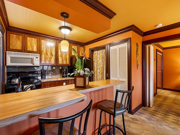 Pull up a seat to enjoy a meal. This kitchen is equipped with full size appliances.
