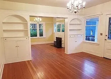 Dining room with built in bookcases; access to side door