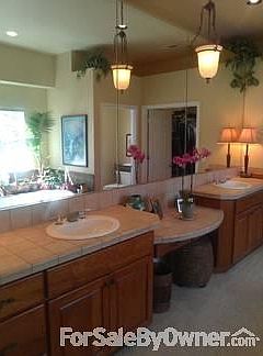 Gourmet Kitchen
						:
						Granite counters; Medium cherry cabinets; Gas range; Trash compactor.