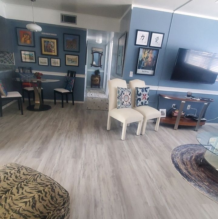 view of hall with mirror. bedrooms off of the hall