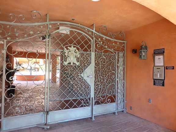 Secure locked gate to interior patio