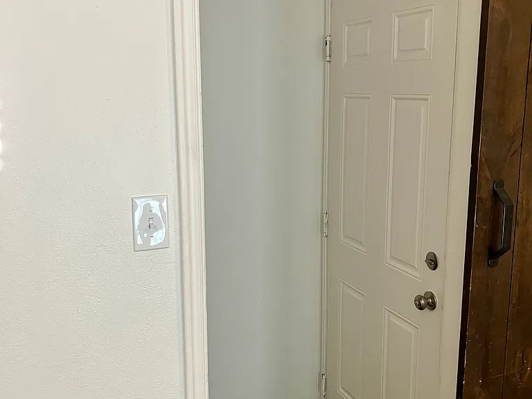 Barn door leading to garage and basement