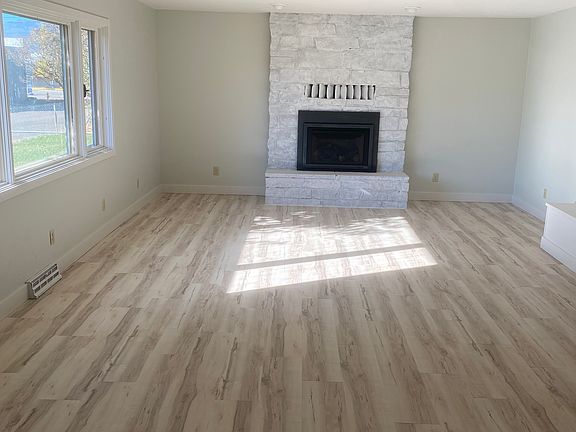 Front Entry opens to living room and fireplace.
