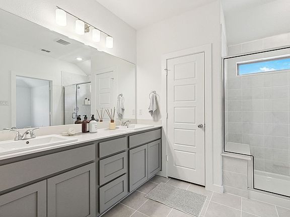 Primary Bathroom in the Emmy II home plan by Trophy Signature Homes - REPRESENTATIVE PHOTO