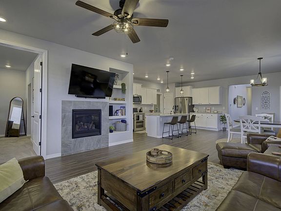 Hardwood floors and an open-concept layout that flows seamlessly from kitchen to living room