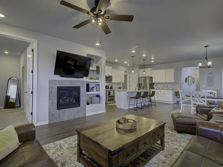Hardwood floors and an open-concept layout that flows seamlessly from kitchen to living room