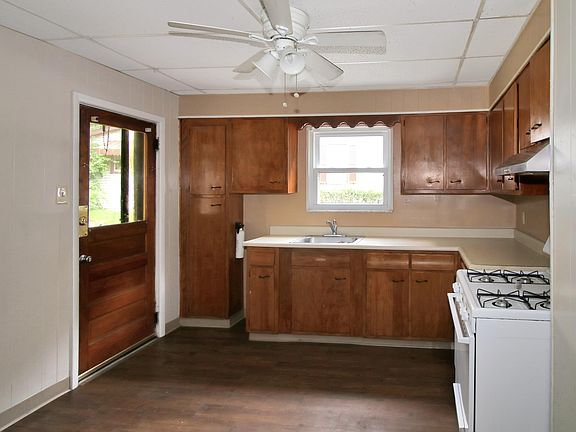 Kitchen; back door goes to small porch and backyard. Can also enter here from large parking pad.
