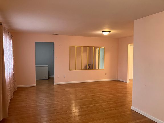 (Dining Room area) in front of house. Apartment is being fully painted.