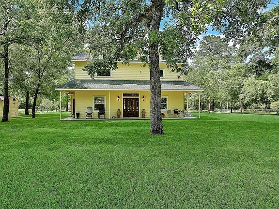 Home is set in the middle of hardwoods and fruit tress.