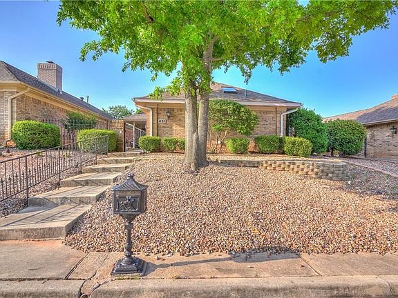 Maintenance free front yard with secure locked gate at entrance.