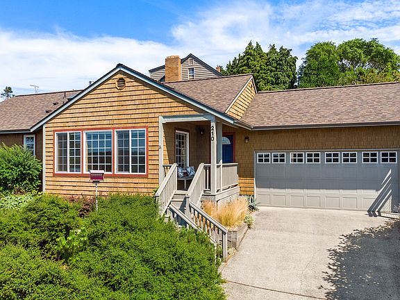 2 car garage with tall ceilings, custom kayak storage system in the garage.