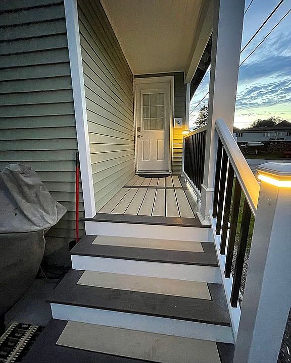 Lighted railing rear porch.