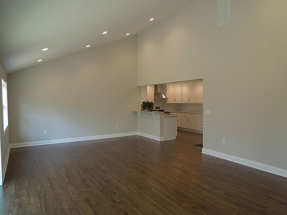 Great Room : Great Room With Cathedral Ceiling, Hardwood Floors, and Recessed Lighting